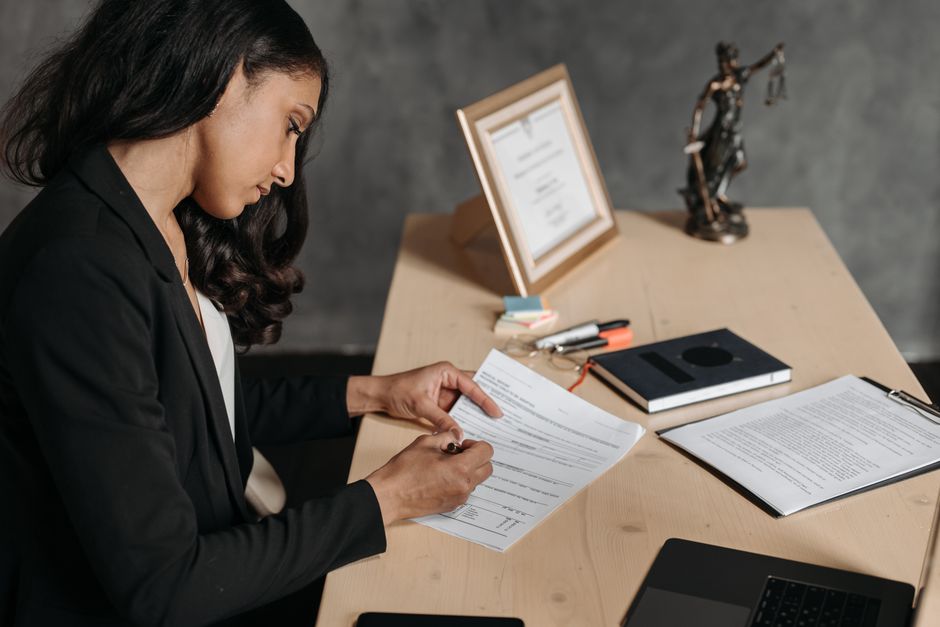 Person reviewing legal documents - pr family sponsorship Person reviewing legal documents - pr family sponsorship